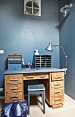Desk against grey-blue wall
