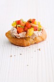 A crostini with tuna and peppers