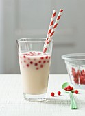 Lactose-free apple and rice milk drink with redcurrants