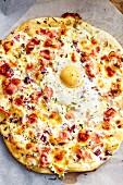 Onion and bacon pizza with a fried egg (soul food)