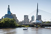 The Red River and the Esplanade Bridge with the Canadian Museum for Human Rights on the left and the skyline of Winnipeg, Province of Manitoba, Canada