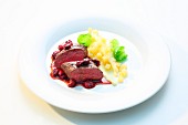 Venison with cranberry sauce and quince and potato mash