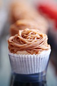 A cupcake with chestnut icing