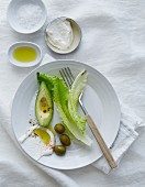 Avocado, olives, lettuce leaves, olive oil, salt and yoghurt