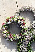 Three different wreaths of sea lavender on wooden boards