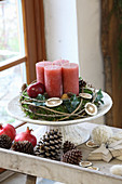 Rustic Advent wreath with red candles on cake stand
