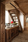 Rustic wooden staircase and antique trunk in chalet