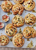 Sugar-free yeast pastries with dried fruits and passion fruit glaze