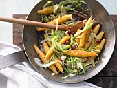 Carrot noodles with hazelnuts and white cabbage