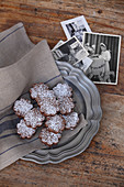 Chocolate biscuits filled with cream and dusted with icing sugar