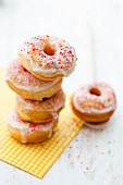 Doughnuts with icing sugar and colourful sugar sprinkles