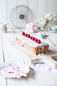 Cream cake with raspberries and sugar