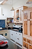 Stripped wooden cabinet in country-house kitchen