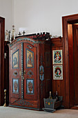 Old farmhouse cupboard with decoratively painted doors