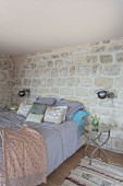 Oriental ambiance and stone walls in bedroom