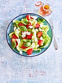 A summer salad with strawberries, goat's cheese and thyme honey