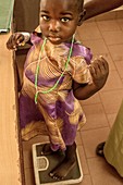 Girl being weighed