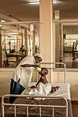 Mother and sick child in hospital
