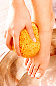 Woman bathing her feet