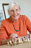 Old woman playing chess