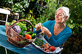 Senior woman preparing vegetables