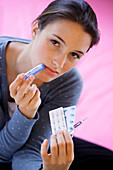 Woman holding medications
