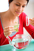 Woman preparing herbal tea