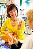 Pharmacist showing products