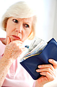 Elderly person counting money