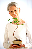 Woman with bonsai