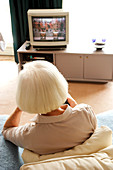 Elderly woman watching TV