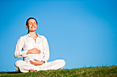 Pregnant woman practising yoga