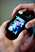 Boy taking picture of a girl in toilets