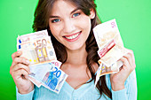 Woman holding Euro banknotes