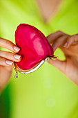 Woman holding an empty moneybox