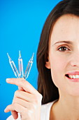 Woman holding ampoules