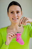 Woman saving coin