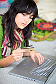 Teenage girl purchasing online