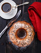 Cake with raisin on a black wooden board