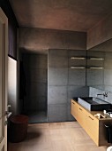 Floor-level shower and grey marble elements in purist bathroom