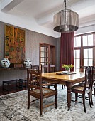 Classic, dark-wood furniture in dining room