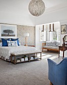 Spacious, country-style bedroom with blue accents