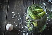 Glass jar with fresh low-salt pickled cucumbers