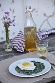Stinging nettles with bacon and fried egg