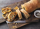 Spinach strudel with feta, leek, carrot and celery