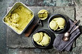 Ice cream Green tea with mint leaves and Spoon for ice cream on stone slate background
