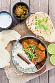 Chicken curry with Papadums in a balti dish
