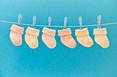 Baby socks hanging on washing line