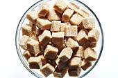 Brown sugar cubes in bowl