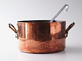 A large copper pot for making soup